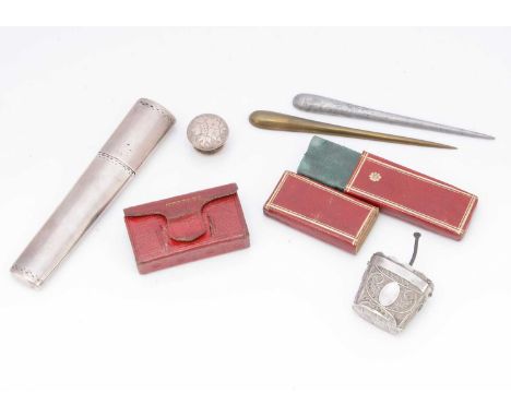 A Georgian silver case and other sewing related items, including a silver bachelor's button, a red leather needle case, a red