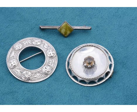 A Celtic silver circular brooch, with Chester hallmark 1948 by Shipton & Co ltd together with a Citrine circular brooch and a