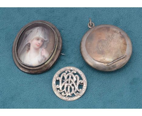 A continental silver and porcelain enamel brooch, depicting a young girl together with a small silver compact dated Birmingha