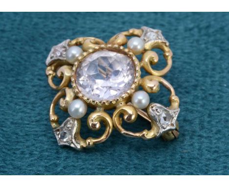A two colour gold sapphire, diamond and pearl quatrefoil brooch, the central circular light pink sapphire af to girdle, surro