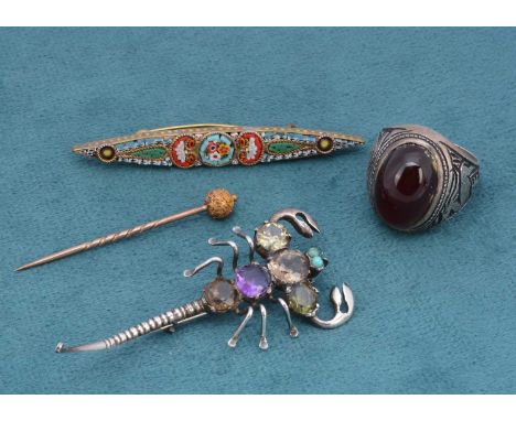 A multi gem set scorpion, in silver, 6.5cm together with a garnet dress ring, a gilt metal and yellow metal stick pin, 5cm an
