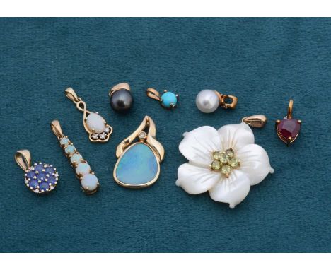 A collection of 14ct and 9ct gold pendants, gem set including a mother of pearl and peridot flower, an opal and diamond, sapp
