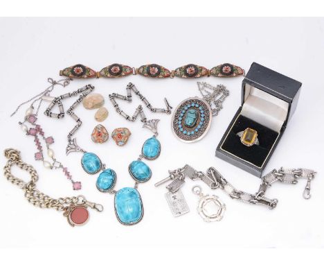 A collection of Middle Eastern and North African silver jewels, including a Chinese token watch chain, a scarab fringe neckla