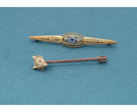 An Edwardian 9ct gold fox stick pin, with fox head and red ruby eyes, 5.6cm x 1cm, 4.1g together with an Edwardian 15ct gold 