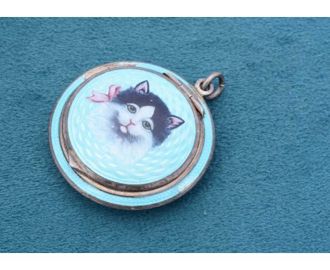 An Art Deco silver and enamel compact, the domed hinged lid painted with a black and white pussy cat with a pink bow, engine 
