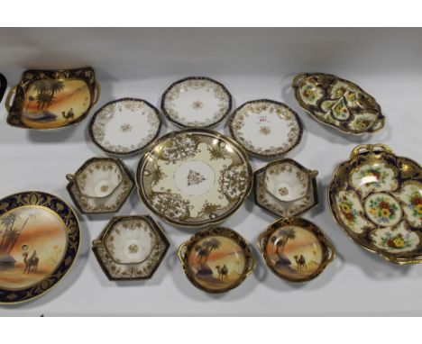 A COLLECTION OF NORITAKE CERAMICS, comprising four typical Eastern examples decorated with figures on a camel, two large flor