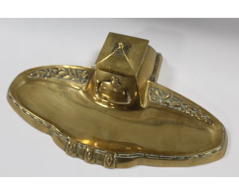 A 20TH CENTURY BRASS SECESSIONIST STYLE INKSTAND, with central inkwell having hinges lid, W 32 cm