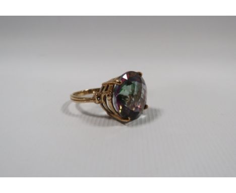 A HALLMARKED 9CT GOLD MYSTIC TOPAZ DRESS RING, the circular cushion effect stone with all over faceted finish, approx weight 