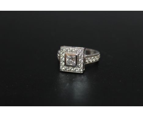 A HALLMARKED HANDMADE 18 CARAT WHITE GOLD DIAMOND RING, set with a central Princess cut diamond of an estimated 0.54 carat - 