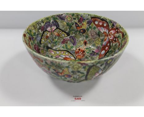A VINTAGE ORIENTAL DECORATIVE HAND PAINTED ENAMELLED BOWL, with butterfly and character mark embellishment, signature to base