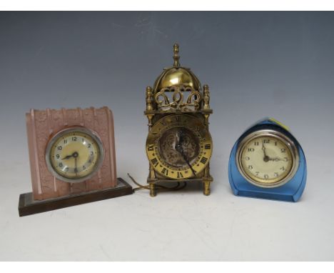 A SMITHS NELL GWYNNE BRASS CASED ELECTRIC LANTERN CLOCK, together with two Art Deco glass dressing table clocks (3)