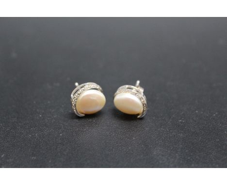 A PAIR OF 14 CARAT WHITE GOLD MOTHER OF PEARL AND DIAMOND EARRINGS, approx combined weight 4.3g, Dia 10 mm