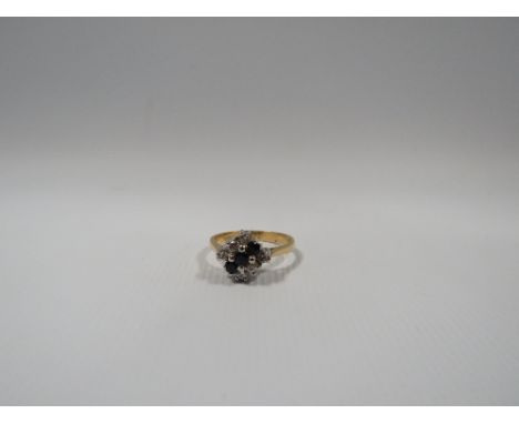AN 18CT GOLD SAPPHIRE AND DIAMOND DRESS RING, the central row of three sapphires flanked by three diamonds either side, appro