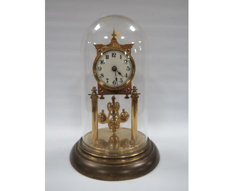 AN EARLY 20TH CENTURY TORSION CLOCK, complete with ball carriage pendulum, under glass dome, H 30 cm