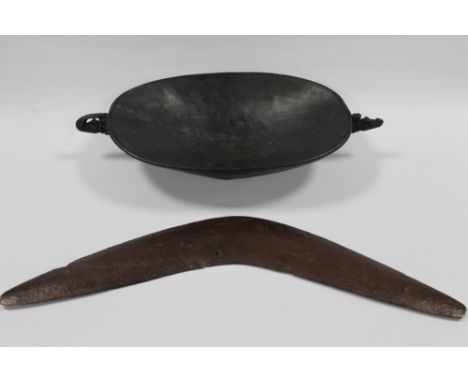 A 19TH CENTURY AUSTRALIAN ABORIGINAL CARVED BOOMERANG, together with a Papua New Guinea Ramu river carved feast bowl with cro