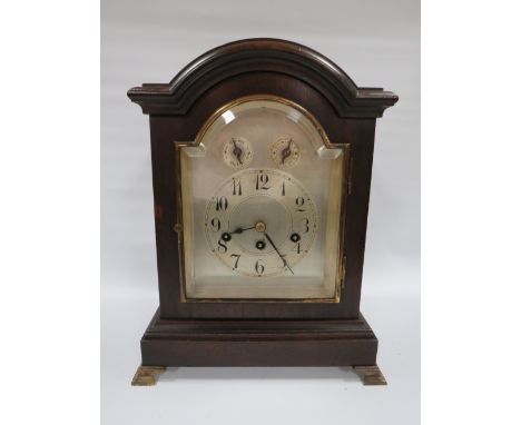 A THREE TRAIN WESTMINSTER CHIME MANTLE CLOCK, with mahogany break arch case, H 40 cm