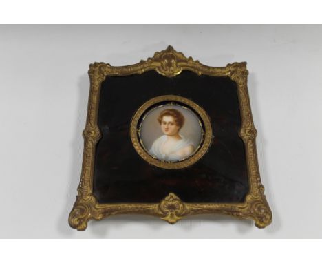 A 19TH CENTURY CIRCULAR PORTRAIT STUDY OF A YOUNG WOMAN ON CERAMIC PANEL, unsigned, framed in decorative frame, Dia. 5.5 cm