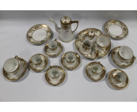 A NORITAKE PART TEA &amp; COFFEE SERVICE, comprising coffee pot, cream, sugar, six coffee cans and saucers, two tea cups &amp