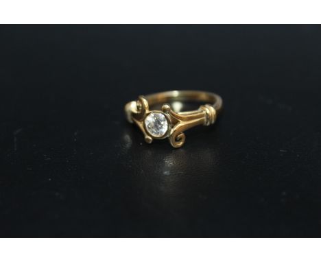 A HALLMARKED 18 CARAT GOLD HALF CARAT DIAMOND RING, in an unusual split swirl band setting, the insurance certificate stating
