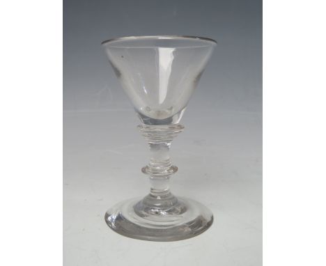 AN 18TH CENTURY WINE GLASS, with conical shaped bowl, three ring annulated knop stem with single knop below, above a domed fo