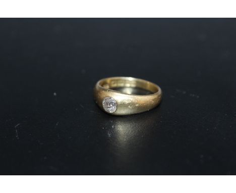 A HALLMARKED 18 CARAT GOLD DIAMOND SOLITAIRE RING, the old European cut diamond being of an estimated three quarters of a car