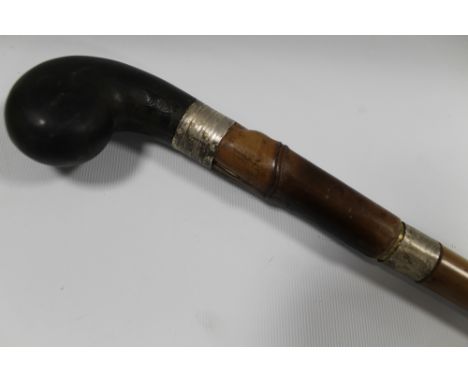 AN ANTIQUE SILVER BANDED SWORD STICK, with ebonised pommel, L 96 cm