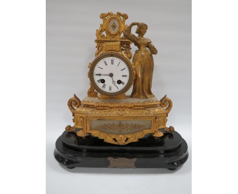 A LATE 19TH CENTURY GILDED SPELTER FEMALE FIGURAL CLOCK. with ornate drum head case having alabaster panels, on wooden base, 