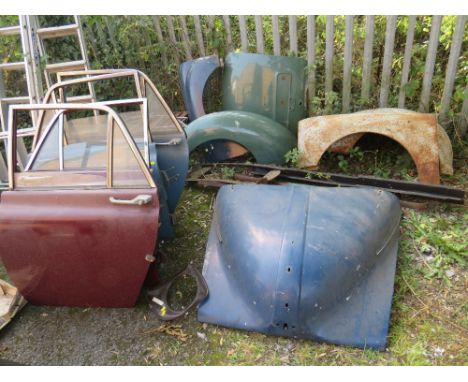 A SELECTION OF VINTAGE CAR BODY PANELS, to include four painted doors, Morris Minor bonnet, boot, dashboard cowl, radiator su