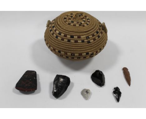 A NATIVE AMERICAN TRIBAL ART CALIFORNIAN COILED BASKET WITH LID, together with a collection of native American obsidian tools