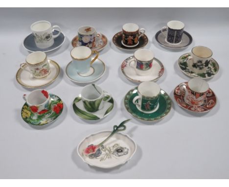 A COLLECTION OF TWELVE ASSORTED COFFEE CANS AND SAUCERS, to include examples by Wedgwood, Royal Doulton, Royal Crown Derby an