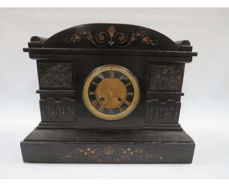 A LATE 19TH CENTURY BLACK SLATE MANTLE CLOCK, the case having an arched top with cherub panelled embellishments, eight day mo