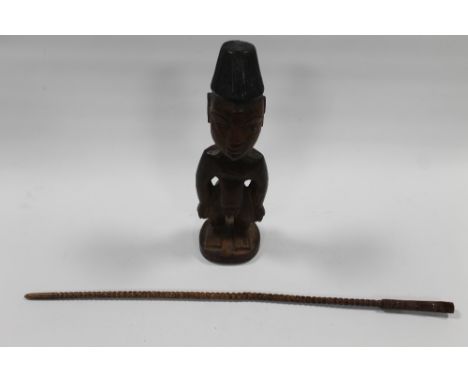 A WEST AFRICAN NIGERIAN MALE YORUBA IGEJI DOLL, with inlaid metal eyes and a West African Baule tribe drum stick with carved 