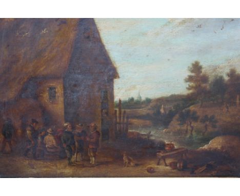 AFTER DAVID TENIERS THE YOUNGER (19TH CENTURY). A country village scene with figures and a seated dog, oil on panel, gilt fra
