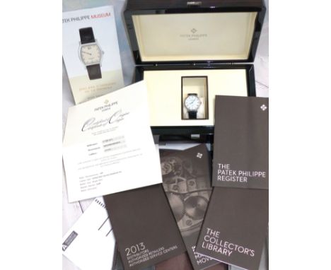A gentleman's Patek Philippe manual 18 carat hallmarked white gold wristwatch with Roman numerals, on black leather strap, an
