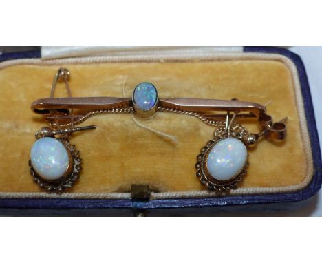 An opal set bar brooch, stamped '9CT'; a similar pair of earrings