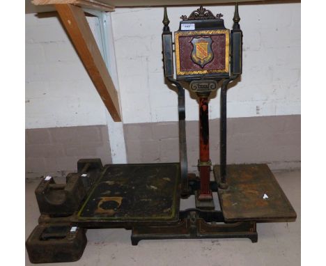 A set of 19th century wrought iron potato scales and weights