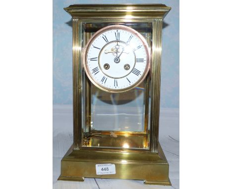 A 19th century brass 4 glass framed mantel clock with white enamel dial, visible escapement, mercury compensated pendulum, an