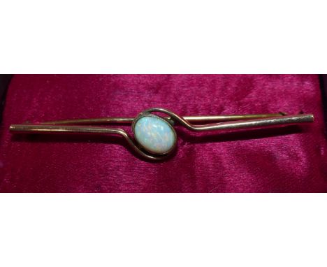 An Edwardian bar brooch set with an opal, stamped '9CT', 3 gm approx