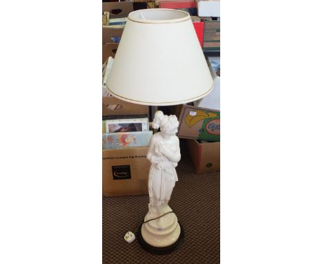 A white pottery standing lady table lamp