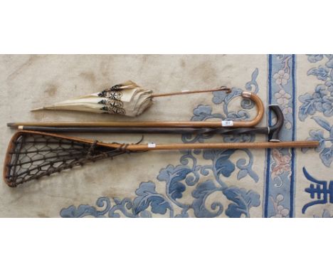A Gold mounted walking cane plus one other, a silk parasol, a vintage Lacrosse stick and Edwardian costume