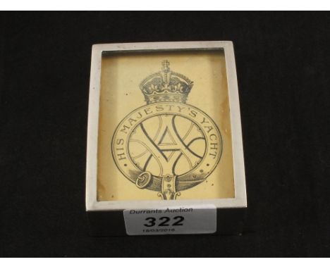 A Silver glazed case containing a card, His Majesty's Yacht with monogram V.A., the reverse showing a Joker playing card, Lon