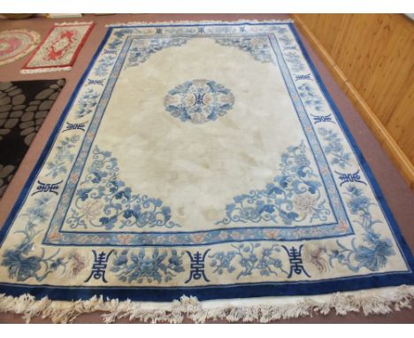 A Chinese blue and floral carpet, 154" x 108"