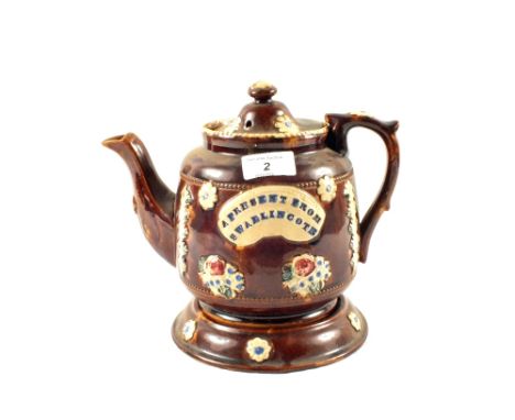 A Victorian Barge ware teapot on stand (chipped handle)