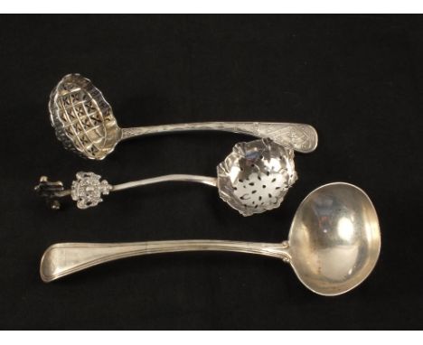 A Victorian Silver sauce ladle, a lattice and star sifter spoon plus another with cherub finial