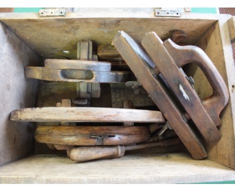 An ammunition box containing various vintage Coopers tools