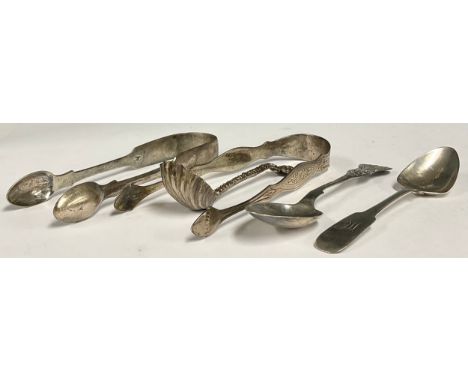 A Victorian silver cream ladle, shell bowl with mask handle terminus, indistinctly hallmarked; two silver teaspoons, Glasgow 