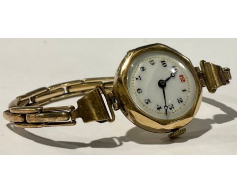 Horology – a 9ct. gold ladies wrist watch 1926 15 jewel Swiss Pilot movement, round case with octagonal facets to enamel dial
