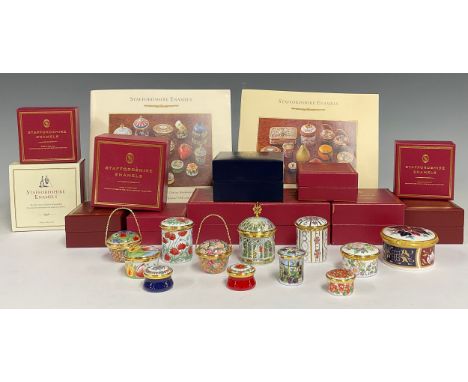 A collection of eleven Staffordshire enamel boxes, various designs; a Royal Worcester enamel box (12)
