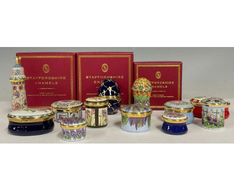 A collection of twelve Staffordshire enamel boxes, various designs