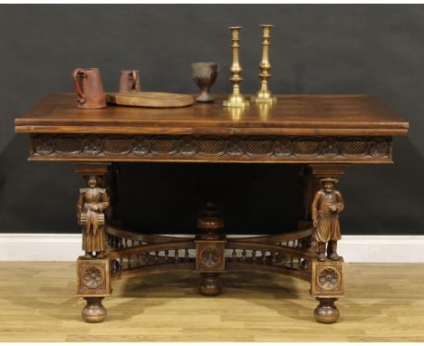 A French Arts &amp; Crafts period oak draw-leaf dining table, in the Henry II taste, parquet de Versailles top, figural suppo